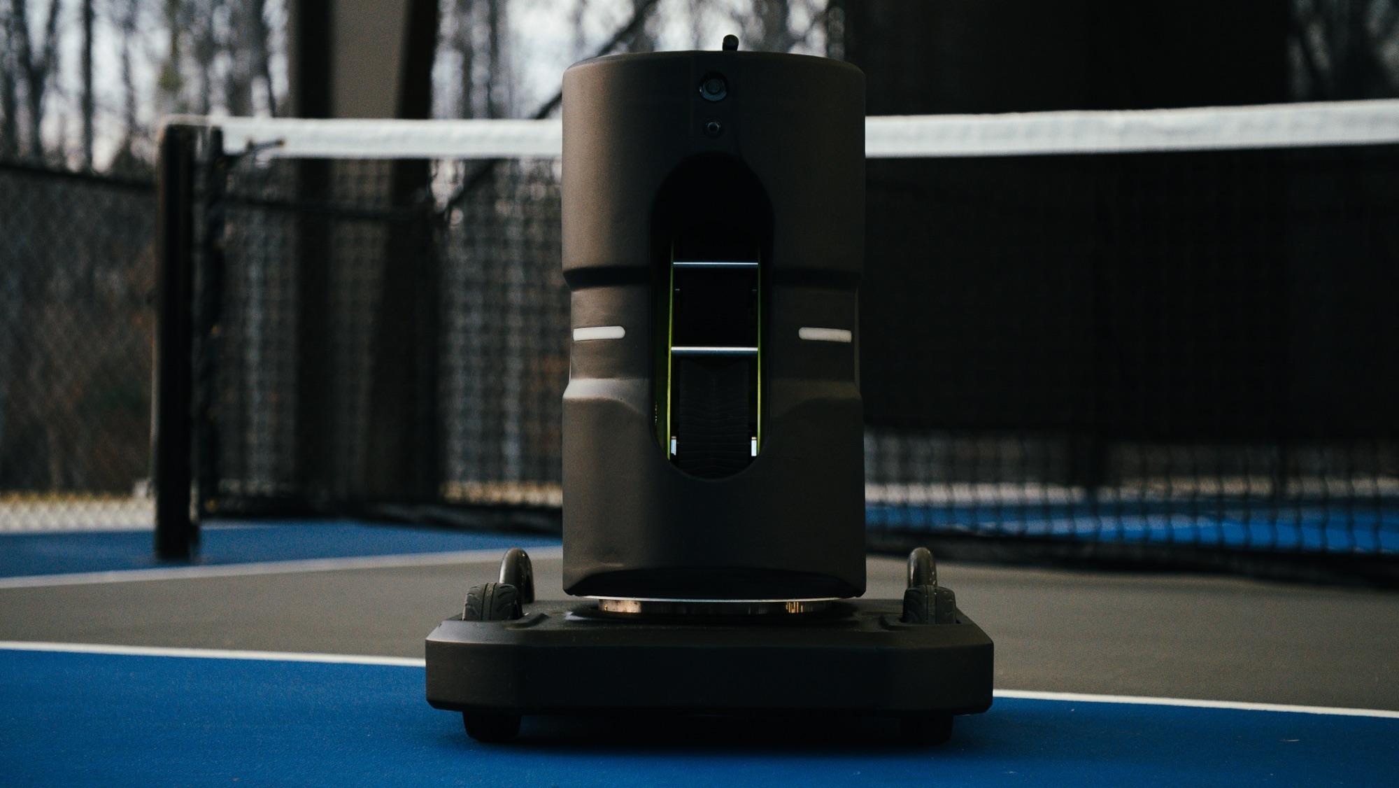 Tennibot Partner V2 ball machine on a tennis court